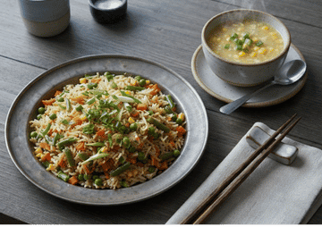 Vegetable fried rice and sweet corn soup featured at Bombay Heritage.